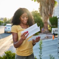 african american woman checking mail in las vegas community african american woman checking mail in las vegas community