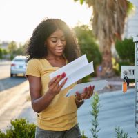 african american woman checking mail in las vegas community