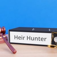 Heir Hunter – Folder with labeling, gavel and libra – law, judgement, lawyer Heir Hunter – Folder with labeling, gavel and libra – law, judgement, lawyer